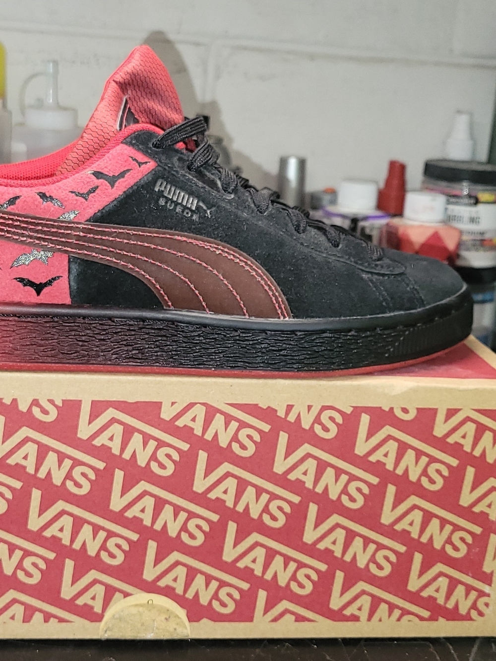 Puma Suede Sneaker in Black with Red Accent